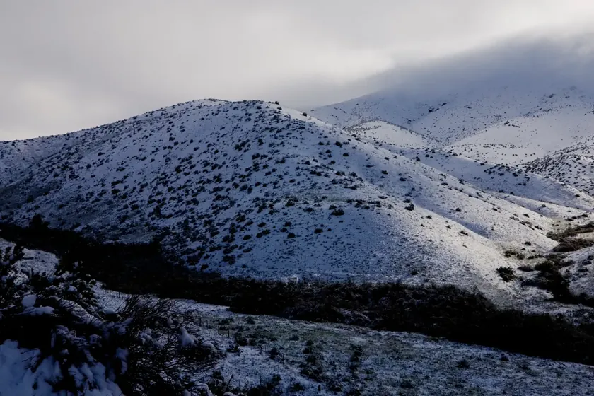 Snow-covered Boise foothills and sagebrush on an overcast winter day.